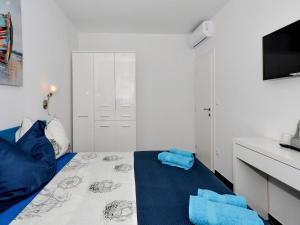 Postel nebo postele na pokoji v ubytování Deluxe Apartman Porto