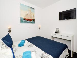 Postel nebo postele na pokoji v ubytování Deluxe Apartman Porto