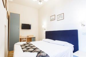 Voodi või voodid majutusasutuse Hotel St. James toas