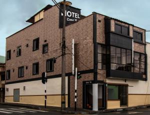 a brick building with a street sign on it at Hotel Casa 10 in Medellín