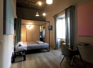 A bed or beds in a room at Il Coro delle Nuvole