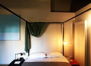 A bed or beds in a room at Il Coro delle Nuvole