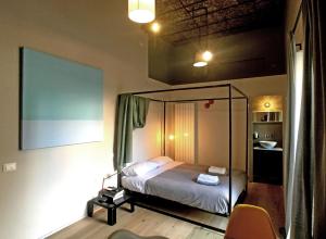 A bed or beds in a room at Il Coro delle Nuvole