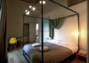 Postel nebo postele na pokoji v ubytování Il Coro delle Nuvole