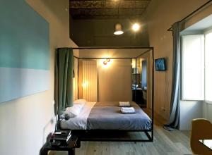 A bed or beds in a room at Il Coro delle Nuvole