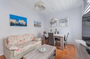 a living room with a couch and a table at 21 Gumers in Madrid