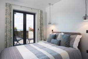 Кровать или кровати в номере Sea Sunset Cottage
