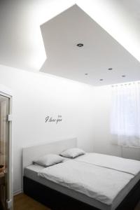 a bedroom with a bed with a white ceiling at Sauna - Flexible SelfCheckIns 6 - Zagreb - Garage - Electric vehicle ccharger - Loggia - New - Luxury - Apartments Repinc 6 in Zagreb