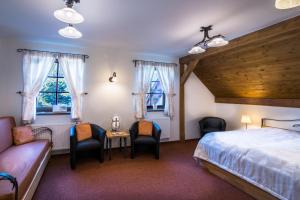 Postel nebo postele na pokoji v ubytování Wellness Hotel Holzberg