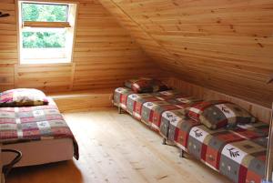 Giường trong phòng chung tại Pokoje Gościnne u Grażyny
