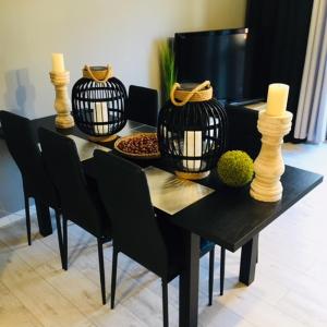 Televízia a/alebo spoločenská miestnosť v ubytovaní Apartament SONIA