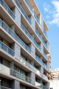 an apartment building with balconies on the side at B131 - Argentina in Cordoba
