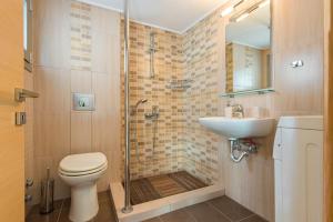 a bathroom with a shower and a toilet and a sink at Studio Evian in Paleo Tsifliki +38 photos