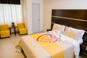 מיטה או מיטות בחדר ב-Verona Hotel Baños Turcos