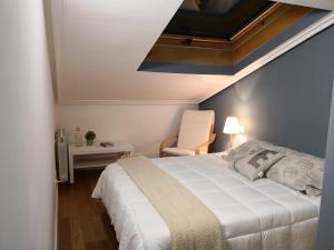 Postel nebo postele na pokoji v ubytování La Casa de la Luna