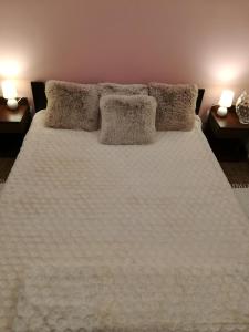 Łóżko lub łóżka w pokoju w obiekcie Apartament wSPAniały.