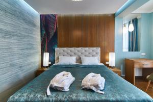 Postel nebo postele na pokoji v ubytování Light Hotel