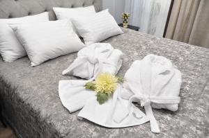 Postel nebo postele na pokoji v ubytování Light Hotel