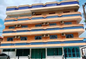 a building with lots of windows on it at Coliseu Palace Residence in Florianópolis