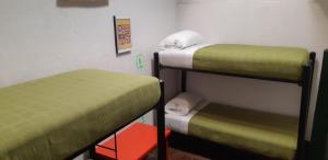 Cama o camas de una habitación en Cedron Hostel