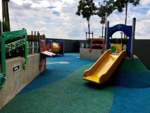 a childrens playground with a slide at Splendid Suite 2 Bedroom @ Sunway & PJ in Petaling Jaya