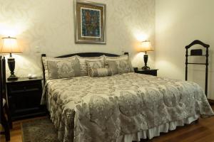 Postel nebo postele na pokoji v ubytování Hotel Casa Divina Oaxaca