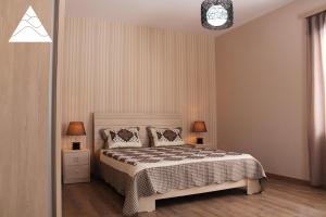 Postel nebo postele na pokoji v ubytování My House in Bakuriani