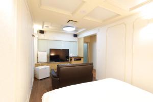 Letto o letti in una camera di Hotel Mio (Adult Only)