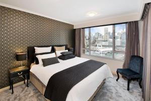Postel nebo postele na pokoji v ubytování Darling Harbour Getaway + 9 fotografií