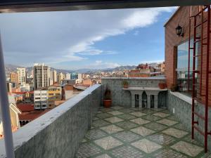 a view of a city from the balcony of a building at Residencial Alta Vista in La Paz