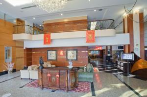 a lobby with a staircase and a living room at Hualien Charming City Hotel in Hualien City