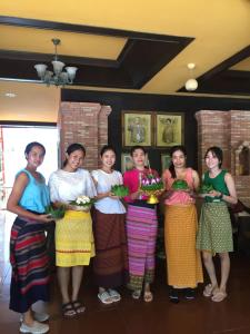 a group of women are posing for a picture at Sea Breeze Resort - SHA Plus in Haad Rin +89 photos