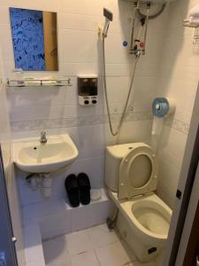 Koupelna v ubytování 嘉應賓館HAKKAS GUEST House