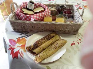 a basket of bread and a plate with a basket of toast at la roulotte de l'ami nature in Barrais-Bussolles +21 photos