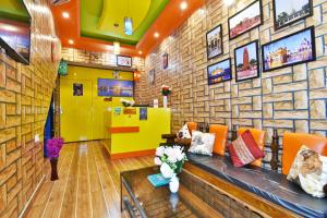 a lobby of a store with a stone wall at Wow Backpackers Hostel in Amritsar