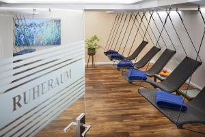TV a/nebo společenská místnost v ubytování Göbel`s Hotel Quellenhof
