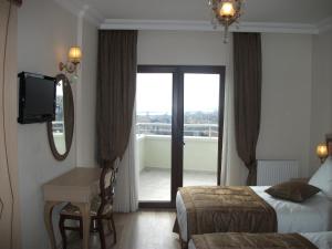 Postel nebo postele na pokoji v ubytování Sultan Palace Hotel