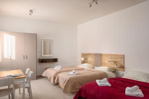 Ένα ή περισσότερα κρεβάτια σε δωμάτιο στο Island Guesthouse