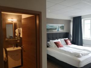 Postel nebo postele na pokoji v ubytování Centrum Hotel