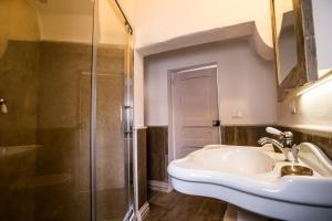 a bathroom with a sink and a shower at Corte di Bonifacio - Luxury Suites in Casarano +71 photos