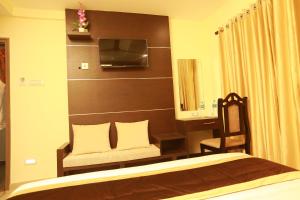 The Crescent Suites客房内的一张或多张床位