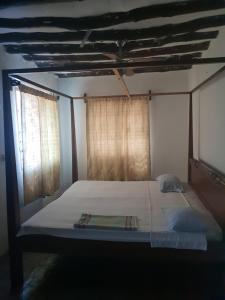 Postel nebo postele na pokoji v ubytování Peponi Watamu