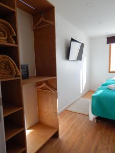 Postel nebo postele na pokoji v ubytování Hostal Buenavista Patagonia