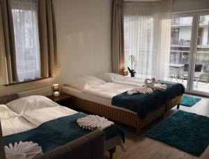 Postel nebo postele na pokoji v ubytování Aparthotel Baltic Spa