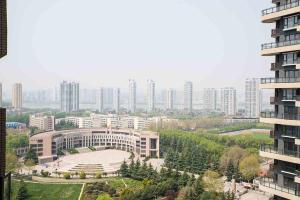 Photo de la galerie de l'établissement Henan Luoyang·Nanhu Music Fountain Square· Locals Apartment 00153160, à Luoyang