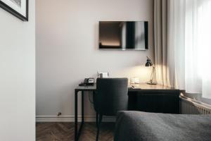 TV in/ali zabaviščno središče v nastanitvi Apótek Hotel Reykjavík by Keahotels