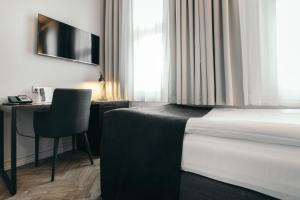 TV in/ali zabaviščno središče v nastanitvi Apótek Hotel Reykjavík by Keahotels