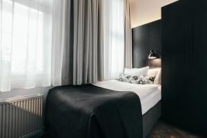Postelja oz. postelje v sobi nastanitve Apótek Hotel Reykjavík by Keahotels