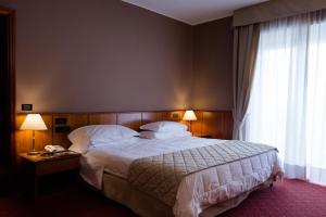 Postel nebo postele na pokoji v ubytování Air Palace Hotel