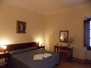 A bed or beds in a room at Il Villino